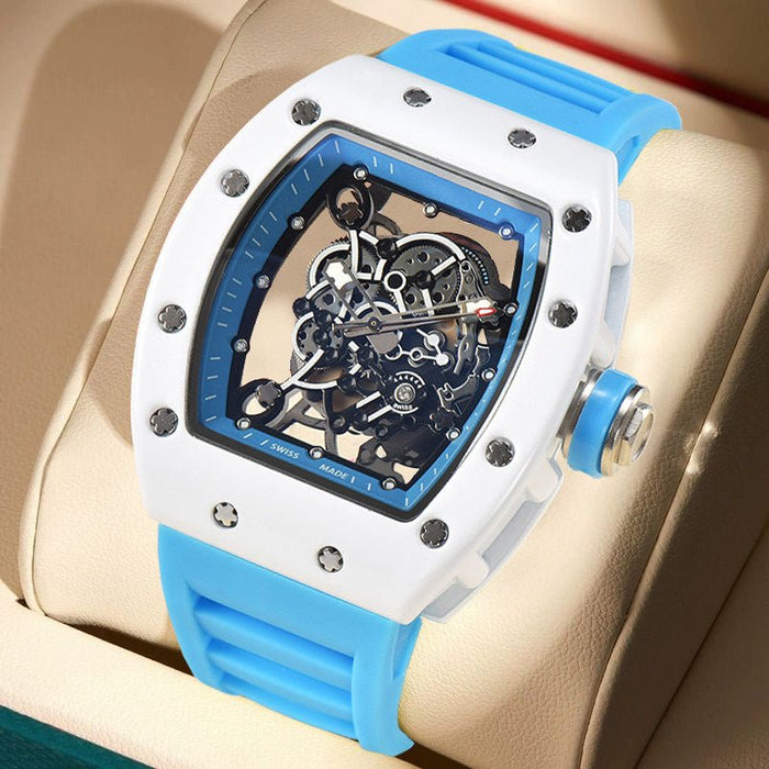 Luxury watch with blue strap and white casing on a beige surface Richard Mille