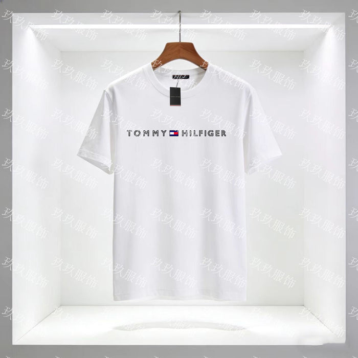 White Tommy Hilfiger t-shirt on a hanger with a clear background