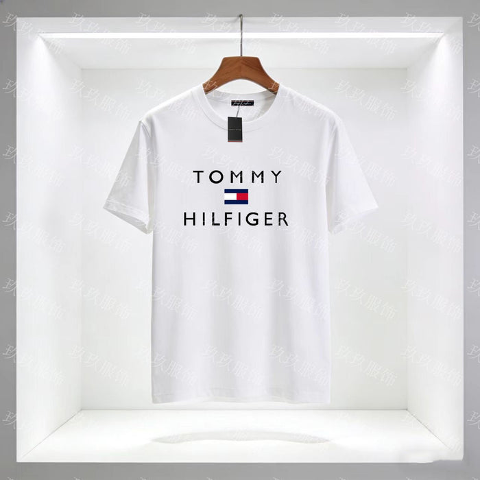 White Tommy Hilfiger t-shirt on a hanger with a clear background