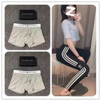 Collage of gray Tommy Hilfiger boxer briefs, a black box, and a person wearing black Adidas pants with white stripes.