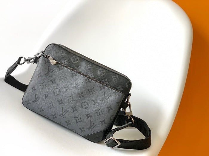 Gray handbag with a brand logo on a white and orange background