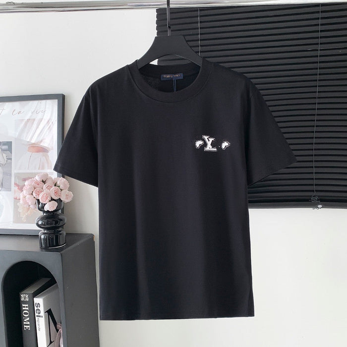 Black t-shirt with a logo on a hanger against a neutral background