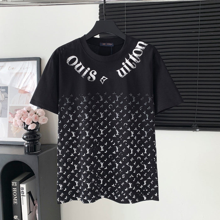 Black t-shirt with white pattern and text on a hanger against a neutral background