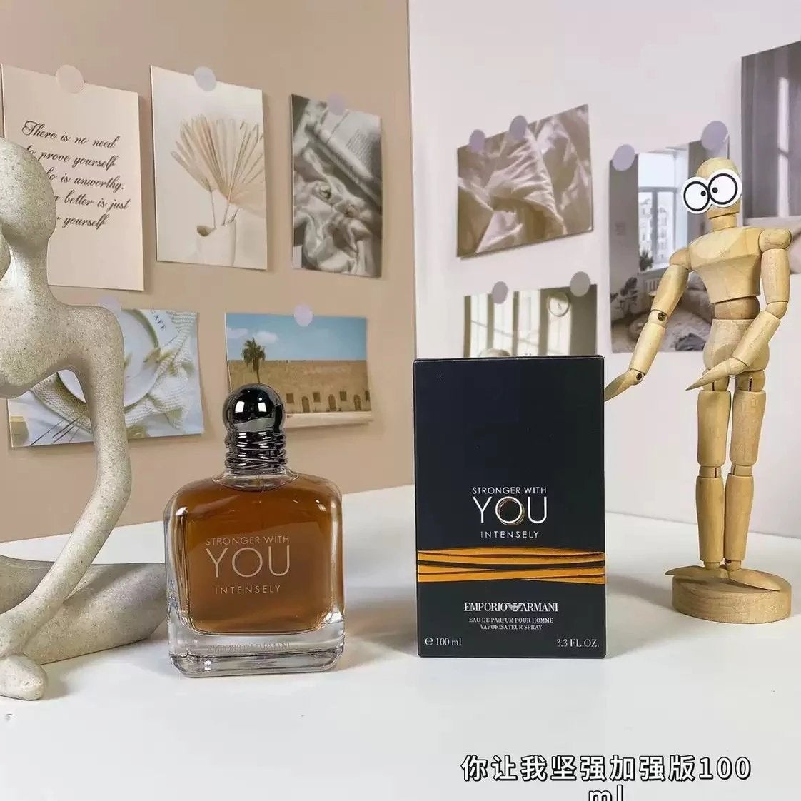Perfume bottle and packaging with decorative items on a table