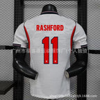 White sports jersey with 'RASHFORD' and number '11' on a mannequin against a grid background.