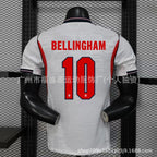 White sports jersey with red and black text and numbers on a mannequin against a grid background.