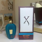Xerjoff perfume bottle and packaging on a table with decorative background