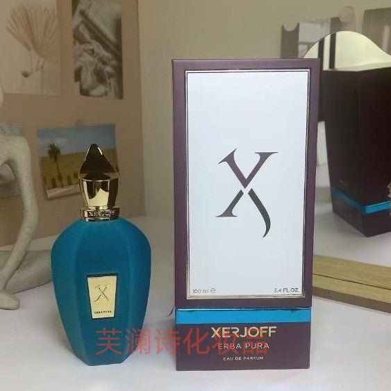 Xerjoff perfume bottle and packaging on a table with decorative background