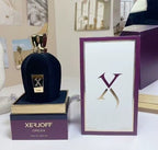 Xerjoff Opera perfume bottle and packaging on a white surface